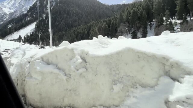 Scenic video of the mountain road and pathway leading to Sonmarg, passing through lush valleys, flowing rivers, and majestic Himalayan landscapes in Jammu and Kashmir.