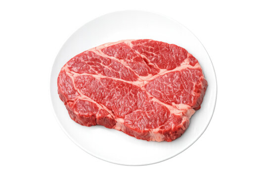 Raw beef chuck eye steak on white plate, fresh red meat cut for grilling or frying, transparent background