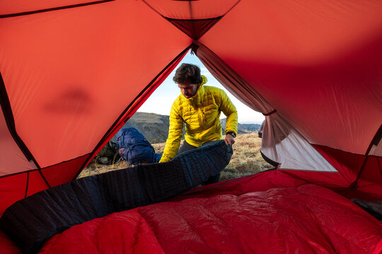 Tired hiker creating warm refuge after demanding outdoor journey
