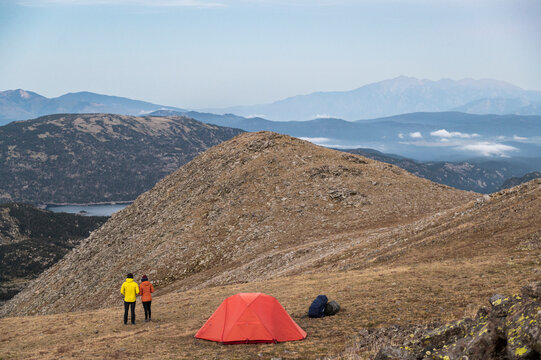 Minimalist mountain camp set during peaceful evening hike