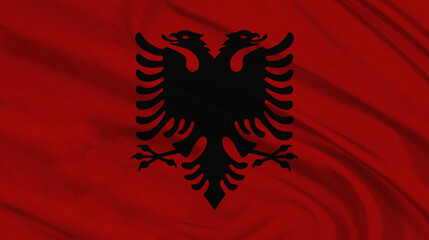 Waving flag of albania featuring the black double headed eagle on a red background