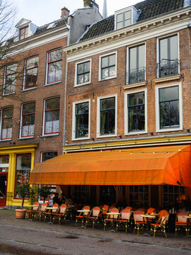 Orange facade of sidewalk cafe in Utrecht, Netherlands 
