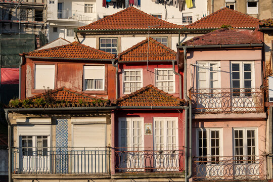 Colorful houses with clay roof in warm evening light