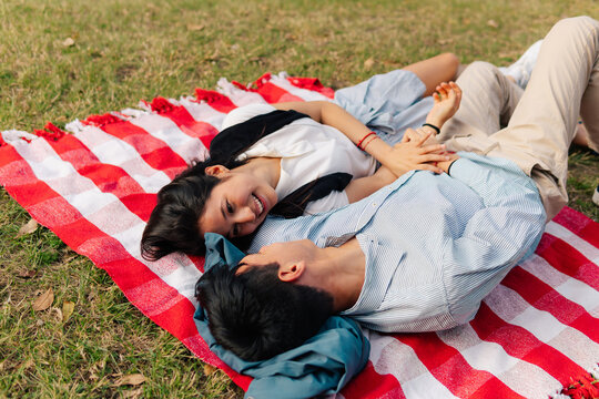 Couple Share Relaxing Picnic Lie