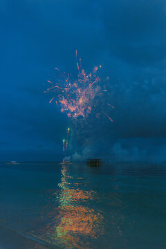New Year's Eve celebration with fireworks on tropical island 