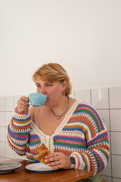 Woman sipping coffee