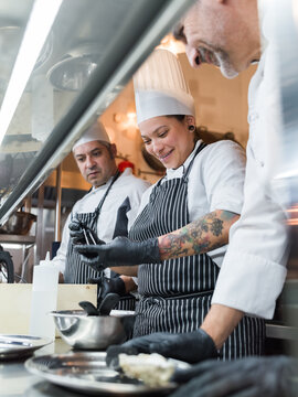 Team of chefs working at kitchen