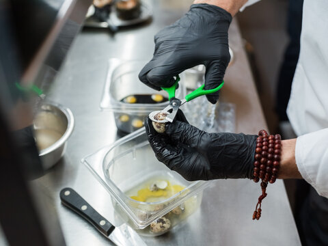 Chef Preparing Quail Eggs in a Professional Kitchen With Precision