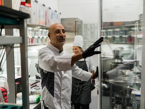 Chefs Collaborating in a Kitchen 