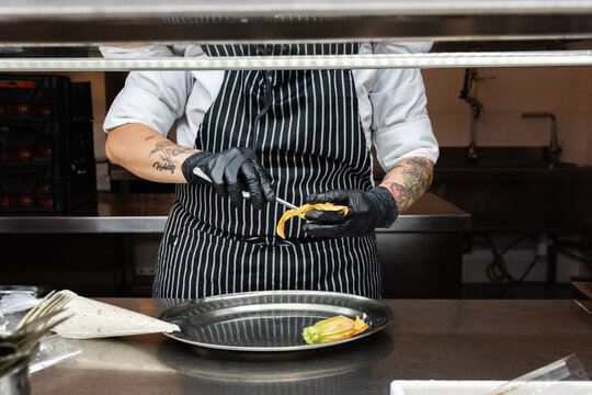Chef cooking squash blossoms 