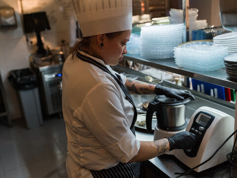 Chef using food processor 