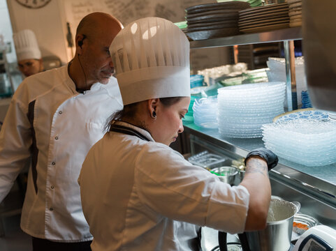 Chef watching his colleague 