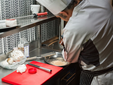 Chef preparing spices for seasoning 