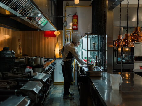 Chef wiping table 