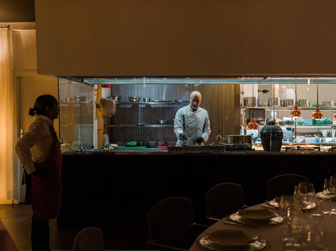 Waitress watching chef 