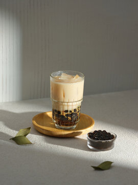 A visually appealing shot of a bubble tea in a glass