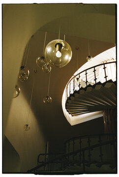 Spiral Staircase with Hanging Lamps