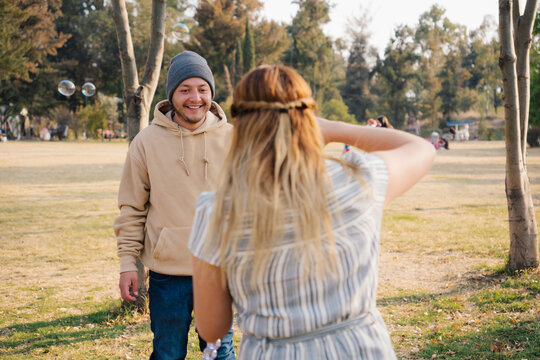 Man Smiles Woman Takes Photo