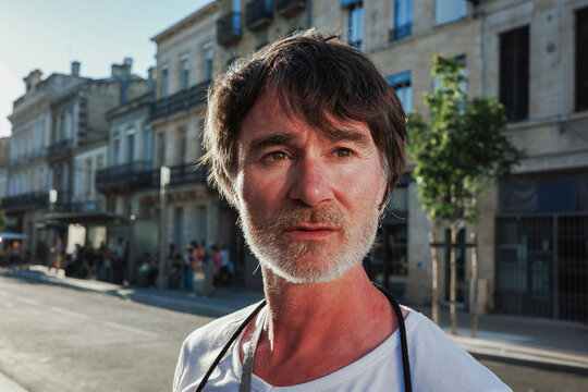 Portrait introspective man Standing on Street 