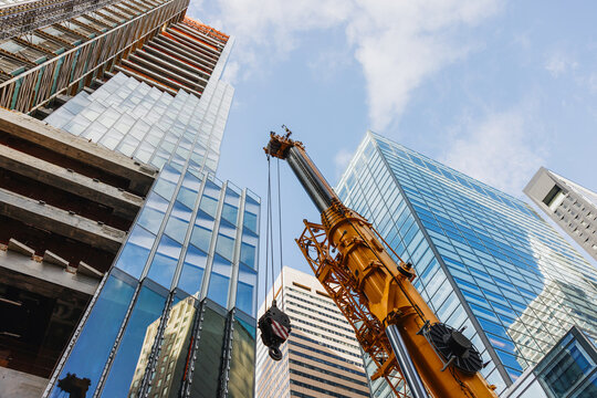 Construction Crane Among Modern Skyscrapers
