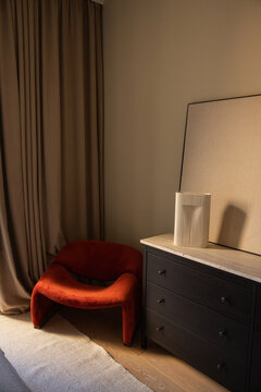 Cozy Corner With Red Chair and Simple Decor in Modern Room