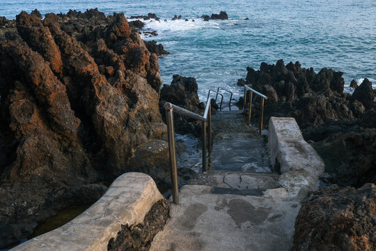 Stone Steps Leading Into Rocky Coast
