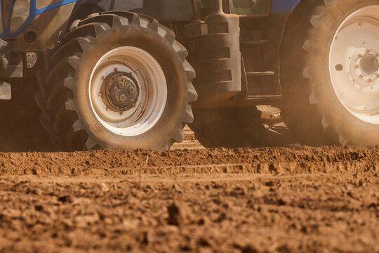 Close-Up of Tractor Tires on Dry Soil