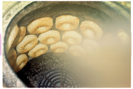 Drying Sliced snacks in a Traditional Round Stone Oven