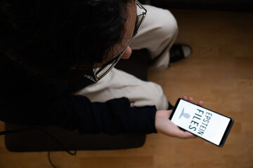 Person Holding Smartphone Reviewing Classified Epstein Files