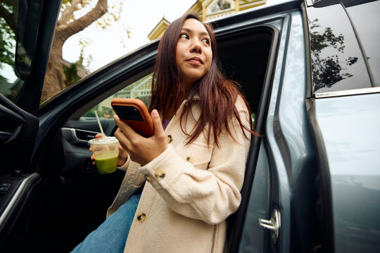 Woman exits the vehicle
