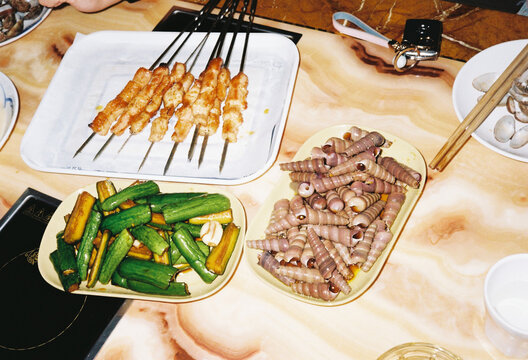 Chinese side dish and chicken skewards. 