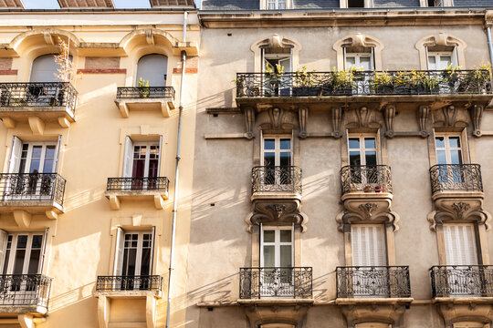 facade of beautiful french windows and balconies 