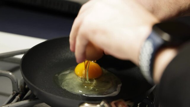 Cracking Egg Into Hot Pan