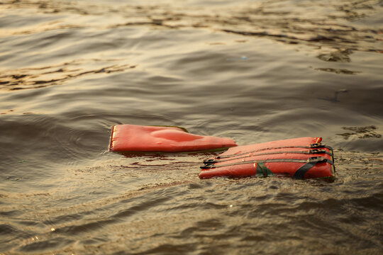 Life Jacket Floating in sea. Sunset