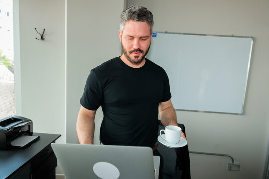 Office Worker Returning with Coffee Break