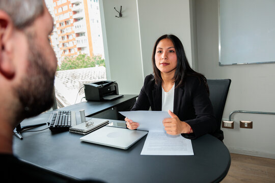 Hiring Manager Reviewing Candidate Paperwork