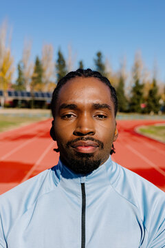Tight portrait of runner reflecting determination focus and dedication