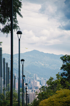 City View With Tall Buildings and Mountains in the Background
