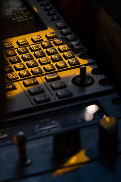Partially Illuminated Flight Management Panel Detail Inside Cockpit