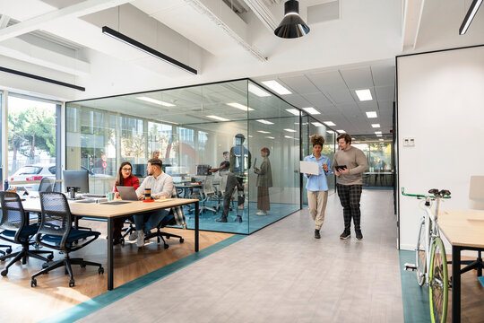 Diverse startup team collaborating in modern open-plan office