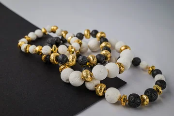 bracelet with natural stones on black background © Golden Shark