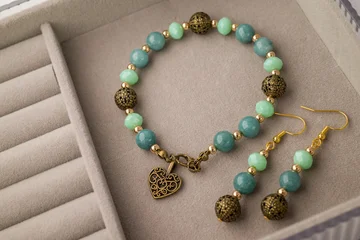 bracelet with natural stones on black background © Golden Shark