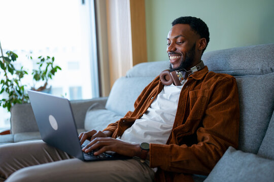 Man on couch with laptop
