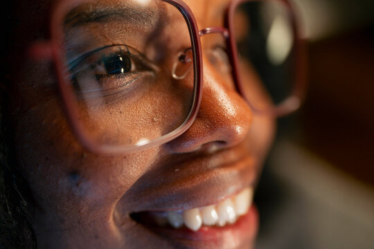 Woman smiling in big glasses
