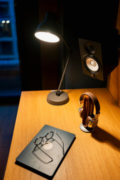Work area with lamp and audio equipment
