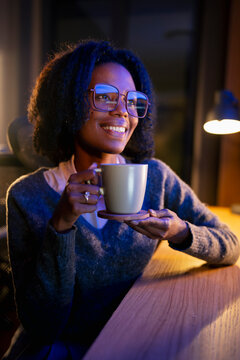 Woman enjoys a drink during the night
