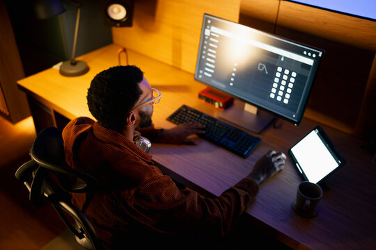 Working late on a computer and tablet
