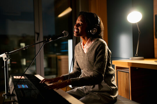 Singer keys at night studio
