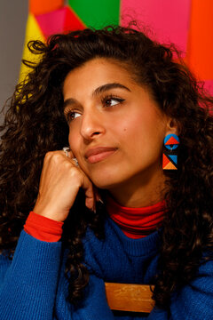 Woman With Curly Hair Looks Thoughtfully 