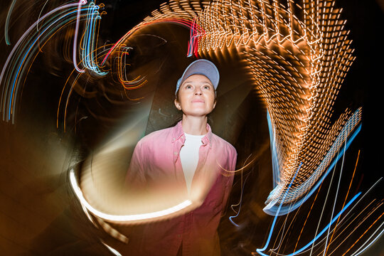 Creative portrait with swirling long-exposure light trails